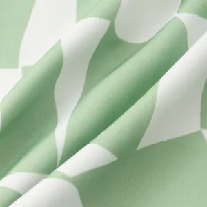 Close-up of lightweight green and white floral pattern fabric for men's casual shirt