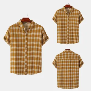 Detailed view of men's mustard plaid short sleeve shirt showing the front and back angles
