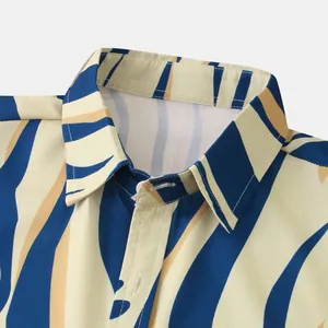 Macro view of men's casual shirt collar featuring blue and tan wavy stripe pattern.