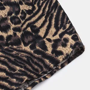 Macro view of leopard print fabric texture and stitching detail on men's casual shirt