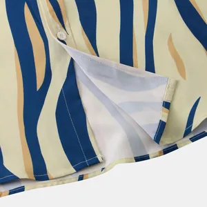Detail of men's slim fit casual short sleeve shirt with blue yellow zebra stripes
