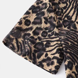 Close-up detail of a men's shirt sleeve featuring a stylish leopard animal print