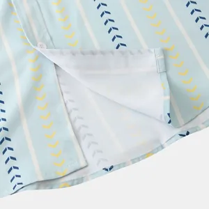 Close-up detail of light blue men's shirt with vertical stripes and chevron pattern