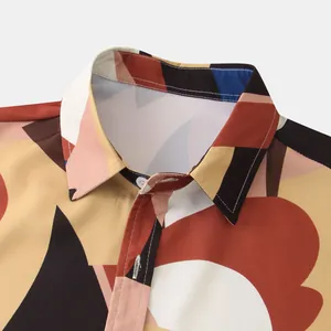 Close-up of men's casual floral shirt collar with geometric print details.