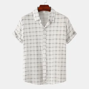 Detail view of men's slim-fit short-sleeved shirt with a classic black and white grid pattern