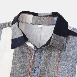 Close-up detail of ethnic plaid men's casual shirt collar showing premium fabric texture