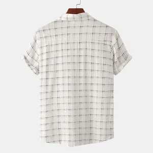 Back view of a men's white short sleeve shirt featuring a minimalist black grid pattern