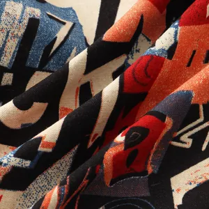 Close-up macro detail of breathable cotton-blend fabric with abstract graffiti print