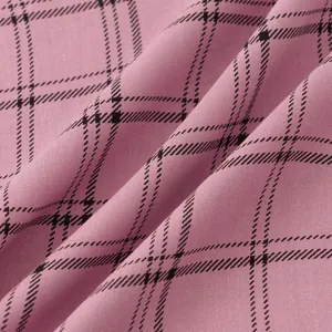 Close-up of pink plaid fabric texture showing fine weave details