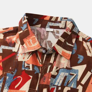 Close-up detail of a men's casual short sleeve shirt with colorful abstract print