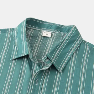 Detailed close-up of green striped shirt collar showing fabric texture and neck label