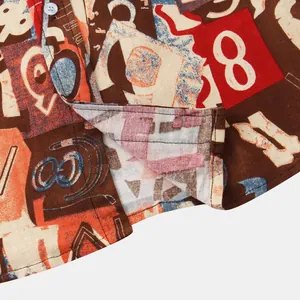 Macro detail of men's casual shirt featuring vintage numeric print and fine stitching.