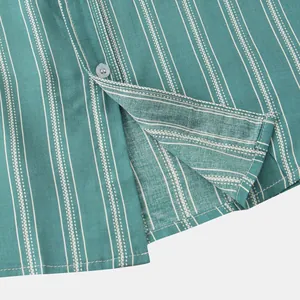 Close-up macro detail of green striped men's shirt fabric showing texture and button.