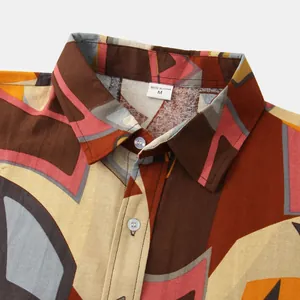Detailed view of men's casual short-sleeve shirt collar with vibrant geometric pattern