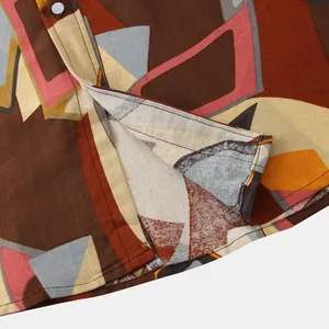 Detailed close-up view of men's casual geometric print shirt hem and fabric texture