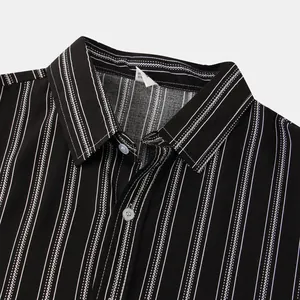 Close-up of black and white striped shirt collar showing fabric texture and buttons