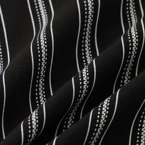 Macro view of the soft black and white striped fabric texture for men's slim fit shirt