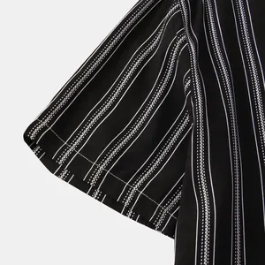 Close-up detail of black and white striped fabric on a men's short sleeve shirt