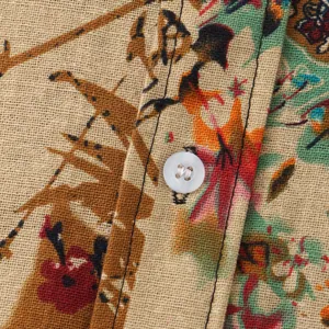 Macro detail view of men's casual floral shirt fabric with linen texture and white button