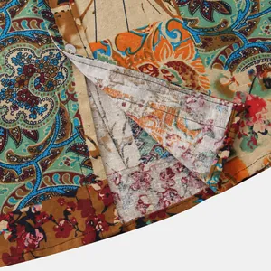 Detailed macro view of men's casual short-sleeve shirt with vintage paisley floral print