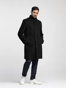 Full view of men's minimalist black trench coat for professional business commute look
