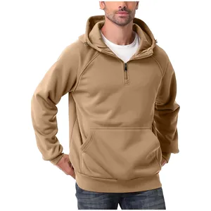 Detail of a men's heavy khaki half-zip hoodie with a front kangaroo pocket and drawstring.