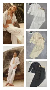 Close-up of water-soluble lace embroidery on long sleeve shirt and wide leg trousers set
