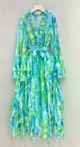 Close-up detail of the ruffle sleeves and rhinestone trim on a floral print maxi dress