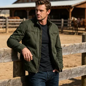 Vintage dark green men's work jacket with stand collar shown in a ranch setting