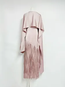 Back detail of pink satin fringe dress with matching cape shrug on mannequin