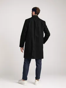 Rear view of a black mid-length men's trench coat showing back vent detail.
