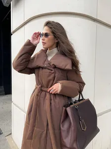 Detail view of stylish brown long puffer coat with waist tie and wide collar