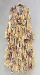 Detailed look at yellow floral maxi dress with ruffle tiers and rhinestone V-neck