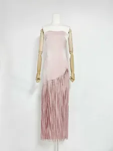 Elegant acetate fringe dress in dusty pink shown in detail on a wooden mannequin