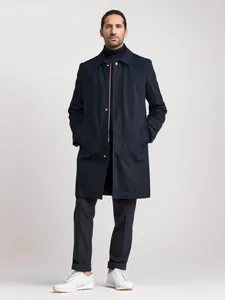 Full body shot of a navy mid-length windbreaker trench coat for a minimalist look.