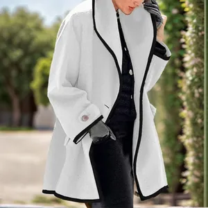 Detailed view of women's white wool coat featuring contrast black piping and loose hood