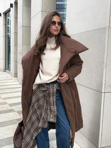 Fashionable long brown puffer coat with oversized collar and casual urban styling