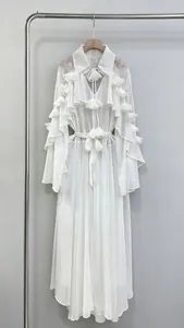 Elegant white long dress with layered ruffles and lace details on a hanger