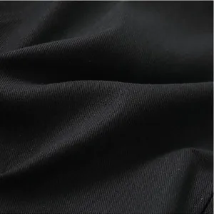 Vista macro detallada de la textura de la tela vaquera negra de alta calidad para chaqueta de hombre