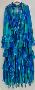Detail view of a blue and green tie-dye long dress with double rhinestone ruffles and belt.