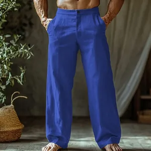 Detailed view of men's blue linen beach pants with button fly and straight leg cut