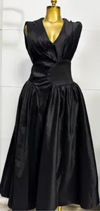 Detailed view of an elegant black sleeveless V-neck pleated waist French style long dress