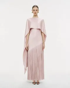 Detailed front view of pink acetate maxi dress with long fringes and elegant shawl overlay