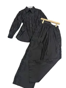 Elegant black shirt and wide-leg pants set with intricate lace cutout embroidery
