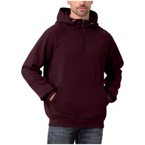 Detail view of a men's heavy burgundy semi-zip hoodie showcasing the fit and kangaroo pocket.