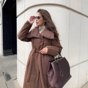 Elegant women's long brown over-the-knee puffer coat with belt and large collar