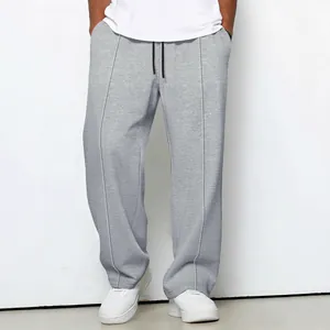 Men's loose grey waffle knit straight leg trousers with adjustable drawstring waist