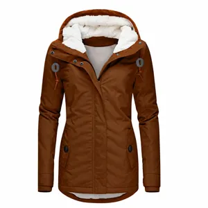 Detail of women's brown mid-length parka jacket featuring a soft white sherpa fleece lining