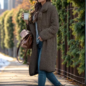 Close-up of brown fuzzy lamb wool long coat texture and fit on a model outdoors