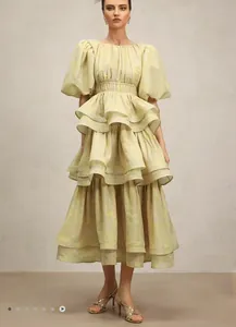 Elegant full-length view of the printed multi-layer ruffle dress with puff sleeves.